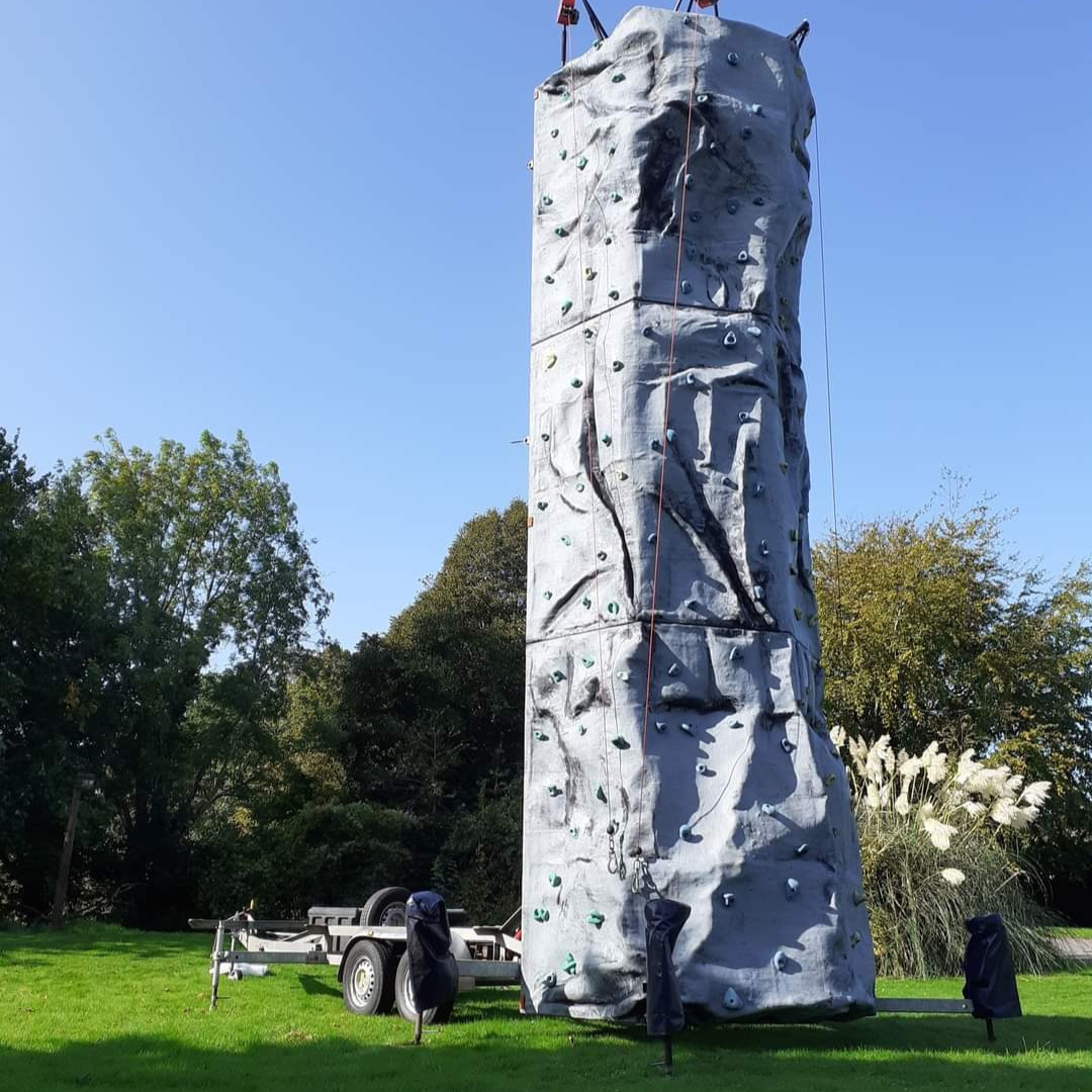 Photo of MonLife Climbing wall in a field.